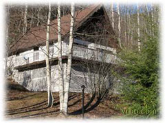 Decks overlook the stream and a beautiful grassy meadow - Blue Ridge Parkway Lodging